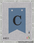A taped needlepoint canvas with the design: Banner 18 mesh count Forked C Black on Blue.