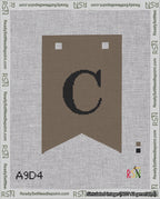 A taped needlepoint canvas with the design: Banner 18 mesh count Forked C Black on Brown.