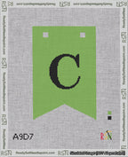 A taped needlepoint canvas with the design: Banner 18 mesh count Forked C Black on Light Green.