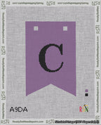 A taped needlepoint canvas with the design: Banner 18 mesh count Forked C Black on Purple.
