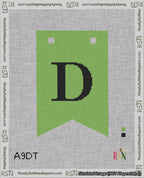 A taped needlepoint canvas with the design: Banner 18 mesh count Forked D Black on Light Green.