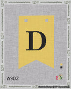 A taped needlepoint canvas with the design: Banner 18 mesh count Forked D Black on Yellow.
