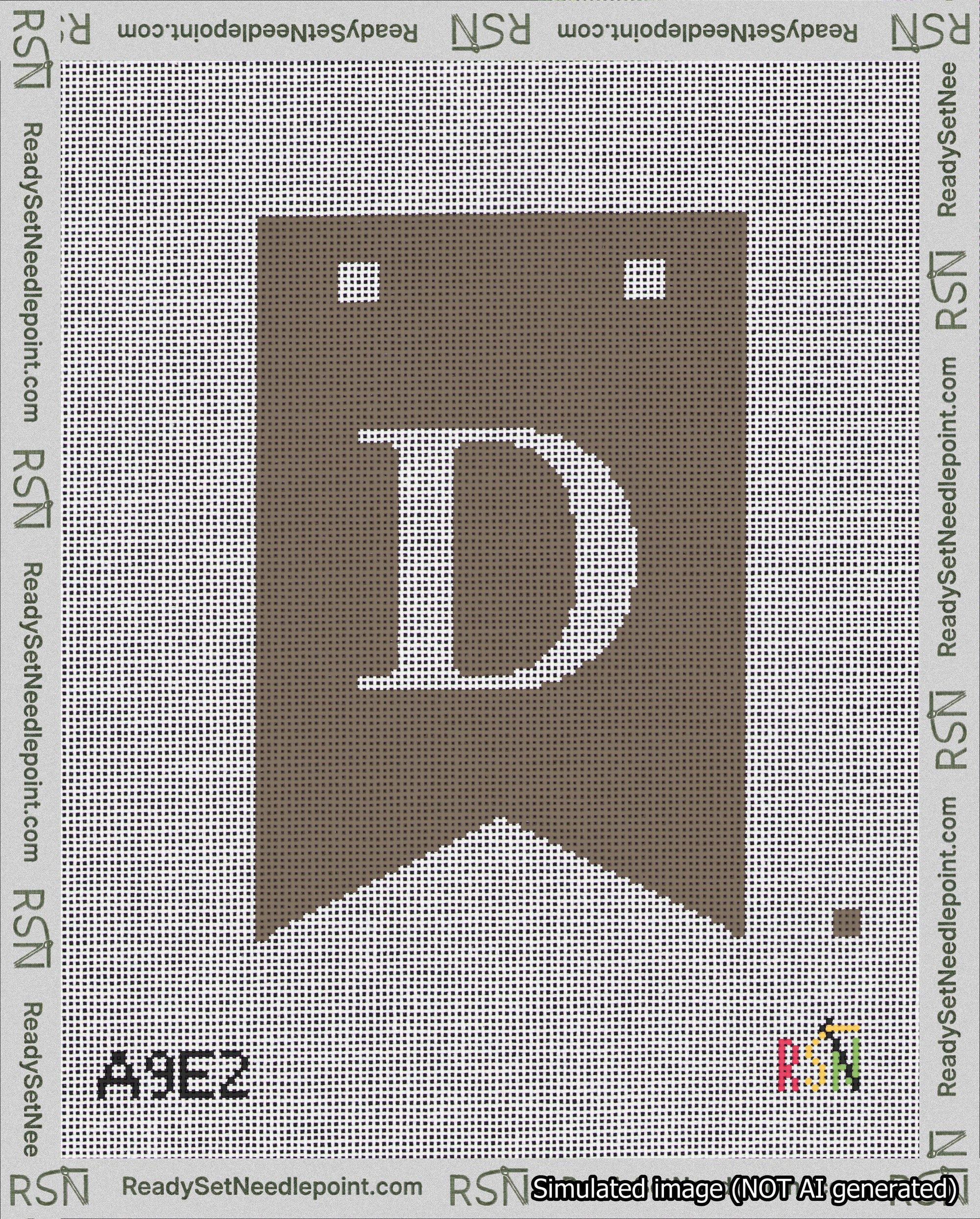 A taped needlepoint canvas with the design: Banner 18 mesh count Forked D White on Brown.