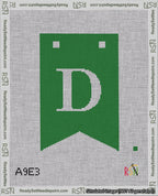A taped needlepoint canvas with the design: Banner 18 mesh count Forked D White on Green.