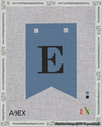 A taped needlepoint canvas with the design: Banner 18 mesh count Forked E Black on Blue.
