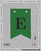 A taped needlepoint canvas with the design: Banner 18 mesh count Forked E Black on Green.