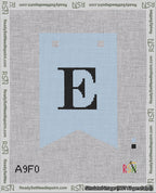 A taped needlepoint canvas with the design: Banner 18 mesh count Forked E Black on Light Blue.