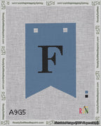 A taped needlepoint canvas with the design: Banner 18 mesh count Forked F Black on Blue.