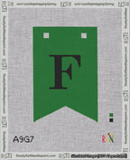 A taped needlepoint canvas with the design: Banner 18 mesh count Forked F Black on Green.