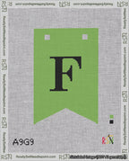 A taped needlepoint canvas with the design: Banner 18 mesh count Forked F Black on Light Green.