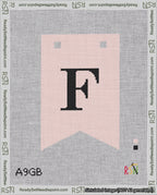 A taped needlepoint canvas with the design: Banner 18 mesh count Forked F Black on Pink.