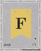 A taped needlepoint canvas with the design: Banner 18 mesh count Forked F Black on Yellow.