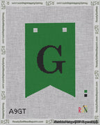 A taped needlepoint canvas with the design: Banner 18 mesh count Forked G Black on Green.