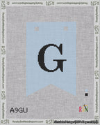 A taped needlepoint canvas with the design: Banner 18 mesh count Forked G Black on Light Blue.