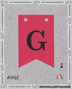 A taped needlepoint canvas with the design: Banner 18 mesh count Forked G Black on Red.