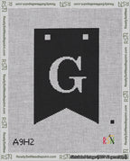 A taped needlepoint canvas with the design: Banner 18 mesh count Forked G White on Black.
