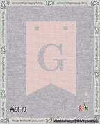 A taped needlepoint canvas with the design: Banner 18 mesh count Forked G White on Pink.