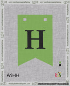 A taped needlepoint canvas with the design: Banner 18 mesh count Forked H Black on Light Green.