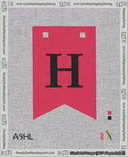 A taped needlepoint canvas with the design: Banner 18 mesh count Forked H Black on Red.