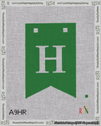 A taped needlepoint canvas with the design: Banner 18 mesh count Forked H White on Green.