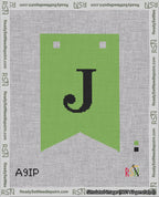 A taped needlepoint canvas with the design: Banner 18 mesh count Forked J Black on Light Green.