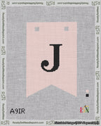 A taped needlepoint canvas with the design: Banner 18 mesh count Forked J Black on Pink.
