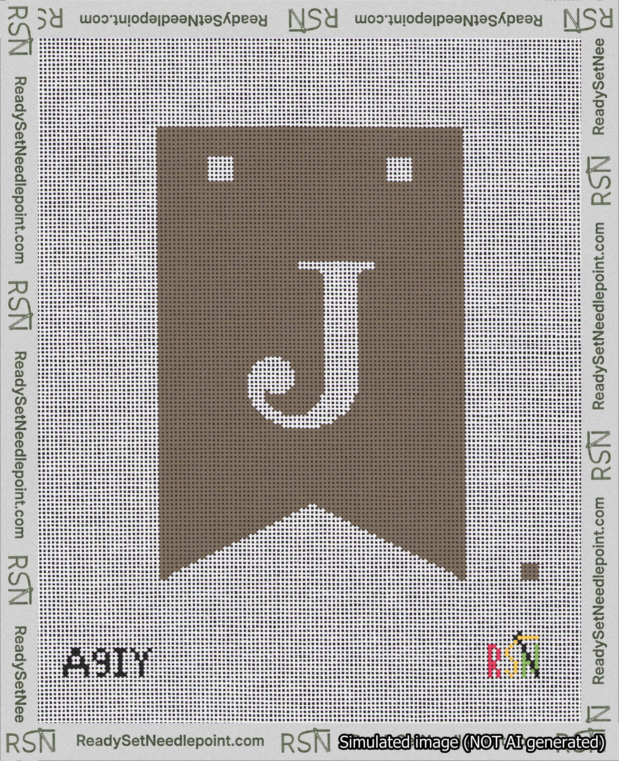 A taped needlepoint canvas with the design: Banner 18 mesh count Forked J White on Brown.