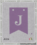 A taped needlepoint canvas with the design: Banner 18 mesh count Forked J White on Purple.