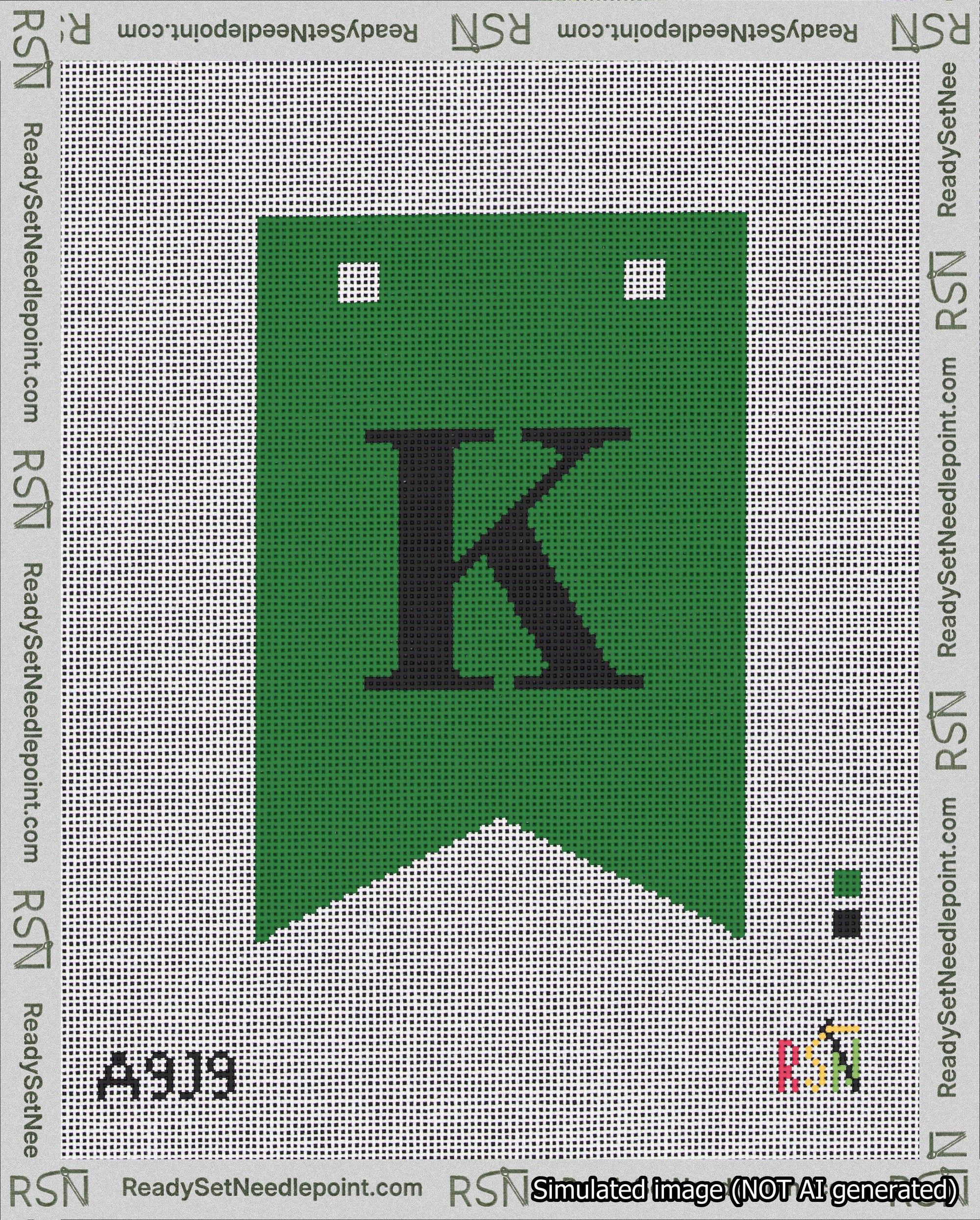 A taped needlepoint canvas with the design: Banner 18 mesh count Forked K Black on Green.