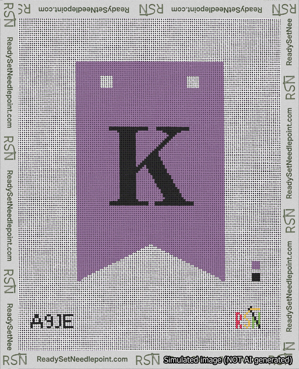 A taped needlepoint canvas with the design: Banner 18 mesh count Forked K Black on Purple.