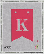 A taped needlepoint canvas with the design: Banner 18 mesh count Forked K White on Red.