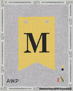 A taped needlepoint canvas with the design: Banner 18 mesh count Forked M Black on Yellow.