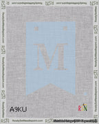 A taped needlepoint canvas with the design: Banner 18 mesh count Forked M White on Light Blue.