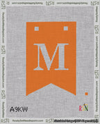 A taped needlepoint canvas with the design: Banner 18 mesh count Forked M White on Orange.