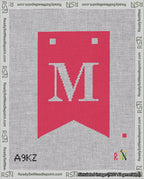 A taped needlepoint canvas with the design: Banner 18 mesh count Forked M White on Red.