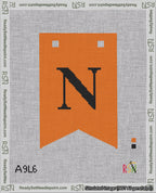 A taped needlepoint canvas with the design: Banner 18 mesh count Forked N Black on Orange.