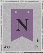 A taped needlepoint canvas with the design: Banner 18 mesh count Forked N Black on Purple.