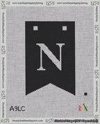 A taped needlepoint canvas with the design: Banner 18 mesh count Forked N White on Black.