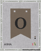 A taped needlepoint canvas with the design: Banner 18 mesh count Forked O Black on Brown.