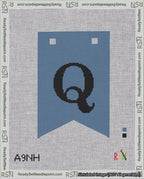 A taped needlepoint canvas with the design: Banner 18 mesh count Forked Q Black on Blue.