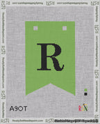 A taped needlepoint canvas with the design: Banner 18 mesh count Forked R Black on Light Green.