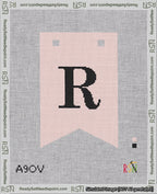A taped needlepoint canvas with the design: Banner 18 mesh count Forked R Black on Pink.