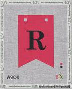 A taped needlepoint canvas with the design: Banner 18 mesh count Forked R Black on Red.