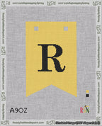 A taped needlepoint canvas with the design: Banner 18 mesh count Forked R Black on Yellow.
