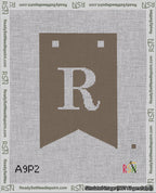 A taped needlepoint canvas with the design: Banner 18 mesh count Forked R White on Brown.
