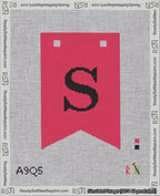 A taped needlepoint canvas with the design: Banner 18 mesh count Forked S Black on Red.