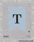 A taped needlepoint canvas with the design: Banner 18 mesh count Forked T Black on Light Blue.