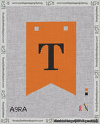 A taped needlepoint canvas with the design: Banner 18 mesh count Forked T Black on Orange.