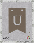 A taped needlepoint canvas with the design: Banner 18 mesh count Forked U White on Brown.