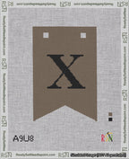 A taped needlepoint canvas with the design: Banner 18 mesh count Forked X Black on Brown.